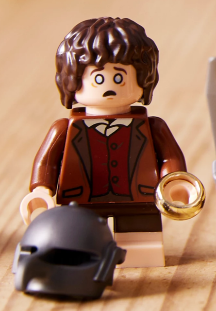 Lego figurine of Frodo Baggins looking tired and scared