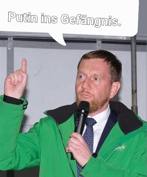 Kretschmer, erhobener Zeigefinger, spruch: Putin ins Gefängnis.
